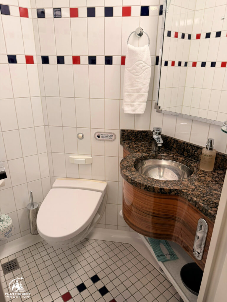 conceirge restroom with upgraded countertop and wood paneling