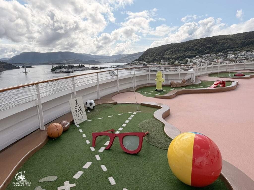 disney cruiseship mini golf with maloy norway in background disney cruiseship mini golf with maloy norway in background