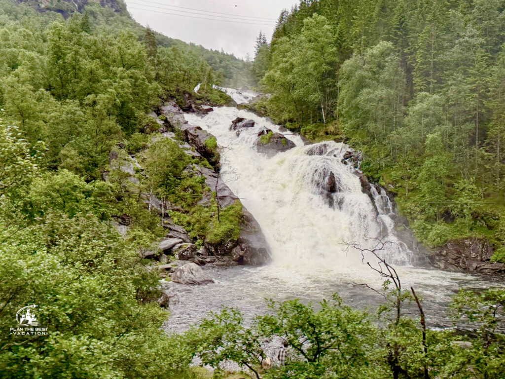 waterfall by the side of the road on scenice drive during Explore Hardangerfjord Crusie Port Excursion